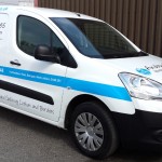 A business card on wheels with Car graphics by Border Signs & Graphics