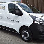 Car Graphics - A Commercial vehicle transformed from a plain plain van into a business card on wheels