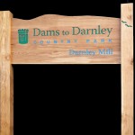 Timber welcome sign with routed text and logo - Dams to Darnley Country Park
